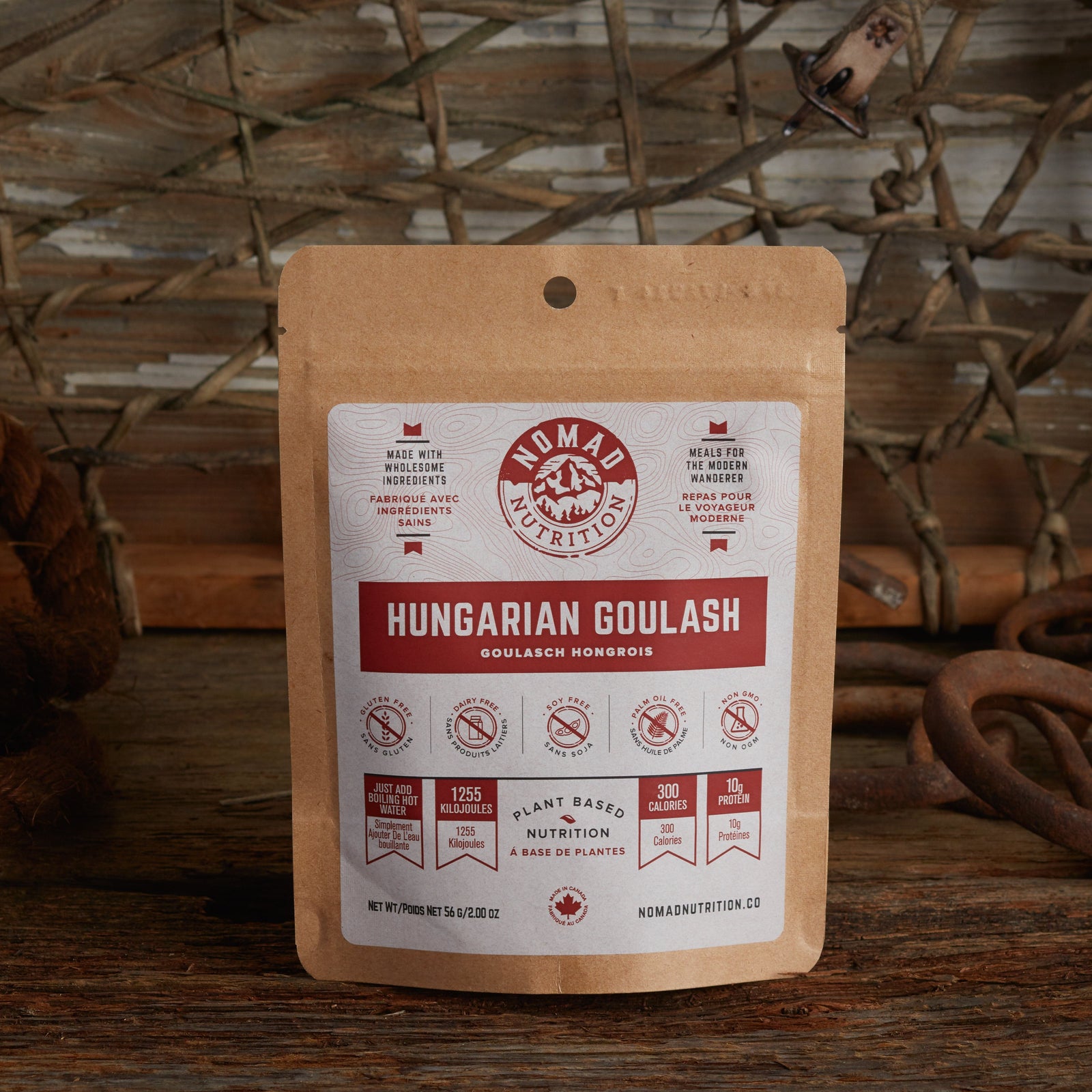 Nomad Nutrition Hungarian Goulash 56g snack size with outdoor equipments on table top.