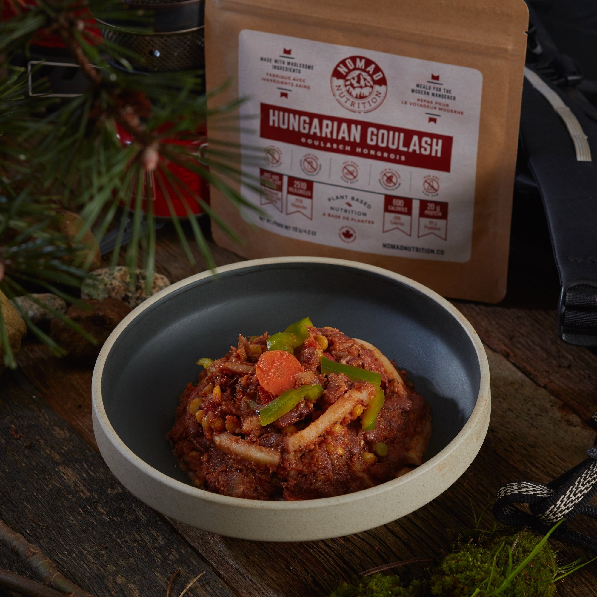 Rehydrated Nomad Nutrition Hungarian Goulash in a bowl with 112g meal size on table top outdoors. No additional cooking required. 