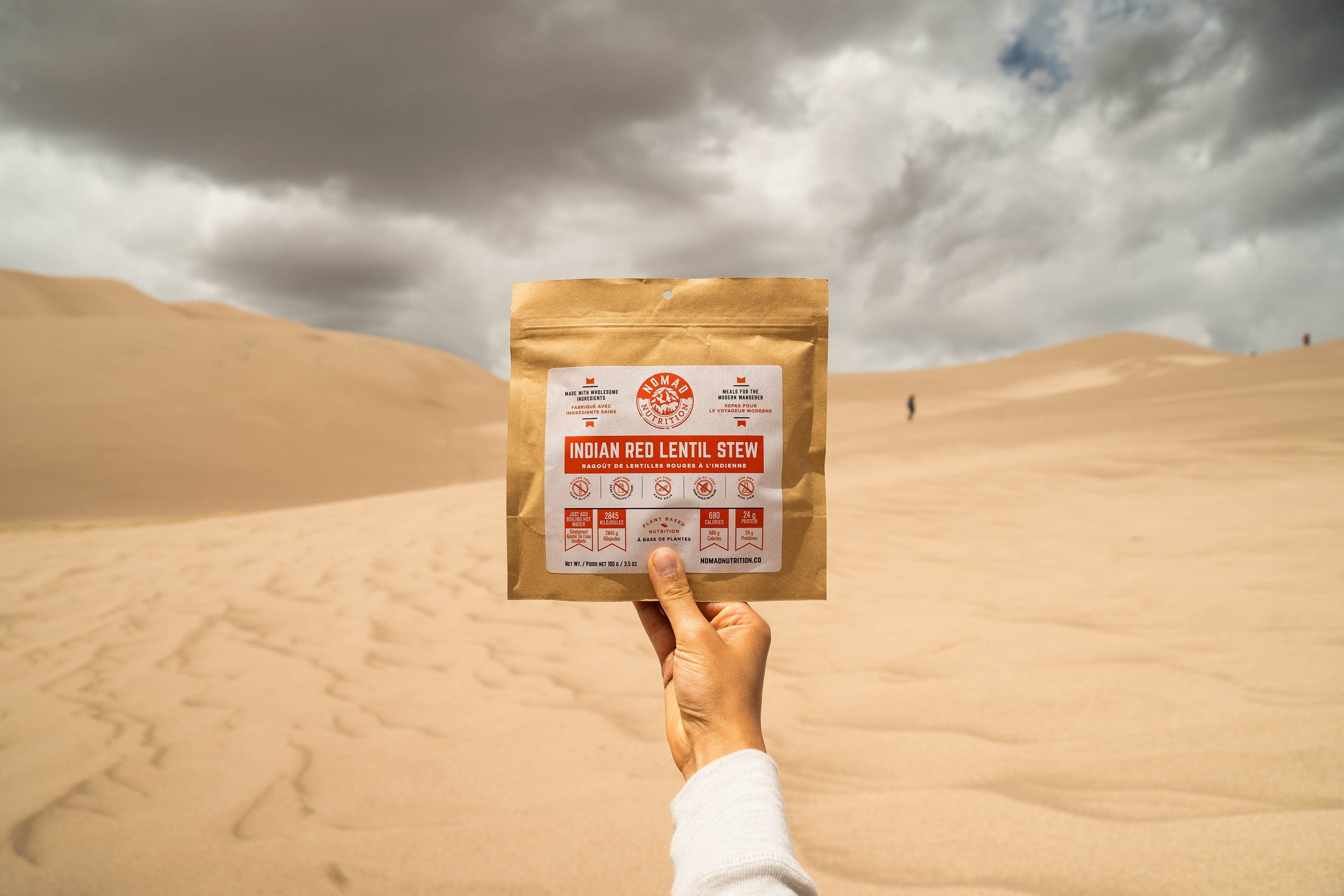 Nomad Nutrition Indian Red Lentil Stew (112g/ 4oz), dehydrated, vegan, adventure, plant-based, gluten-free meal overlooking the scenic outdoor view in the desert. Perfect for trips to national parks.