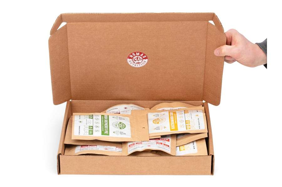 Nomad Nutrition Mega Pack with 12 meals (six meal sizes 112g and six snack sizes 56g) in a box.