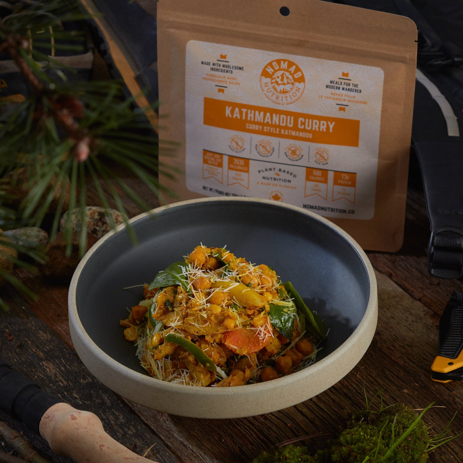 Rehydrated Nomad Nutrition Kathmandu Curry in a bowl with 112g meal size on table top outdoors. No additional cooking required.