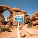 Nomad Nutrition Carribean Curry, vegan dehydrated adventure, camping, plant-based, gluten-free meal picture at Double Arch Trail, Arches National Park. 