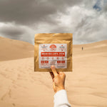  Nomad Nutrition Indian Red Lentil Stew (112g/ 4oz), dehydrated,  vegan, adventure, plant-based, gluten-free meal overlooking the scenic outdoor view in the desert. Perfect for trips to national parks.