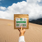 Nomad Nutrition Hungarian Goulash, vegan dehydrated adventure, camping, plant-based, gluten-free meal pictured at a scenic desert in a national park. 