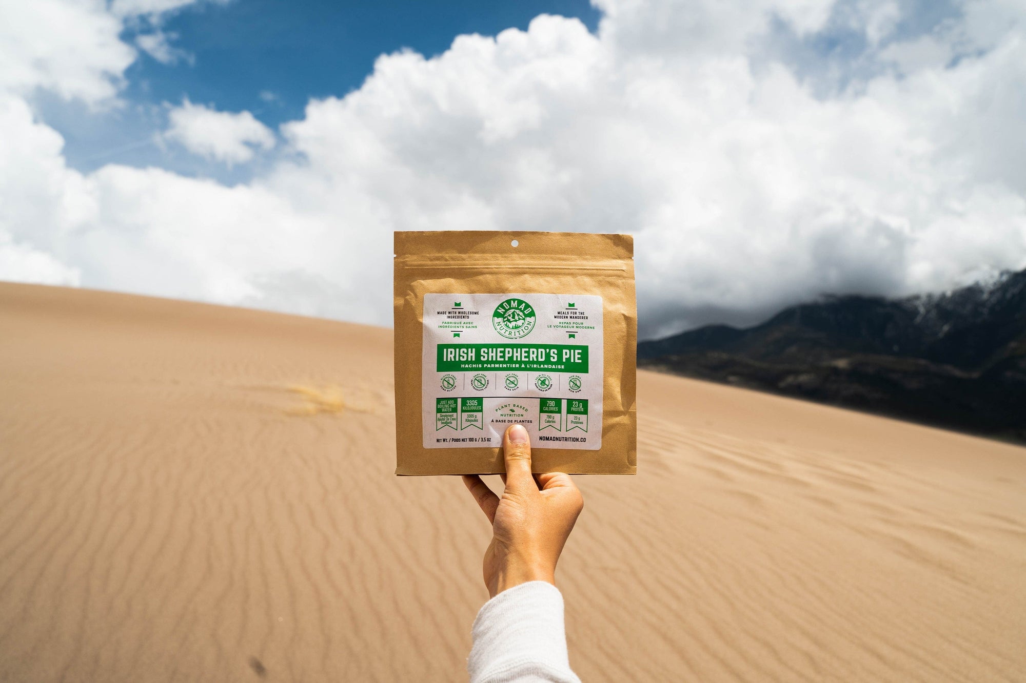Nomad Nutrition Hungarian Goulash, vegan dehydrated adventure, camping, plant-based, gluten-free meal pictured at a scenic desert in a national park. 