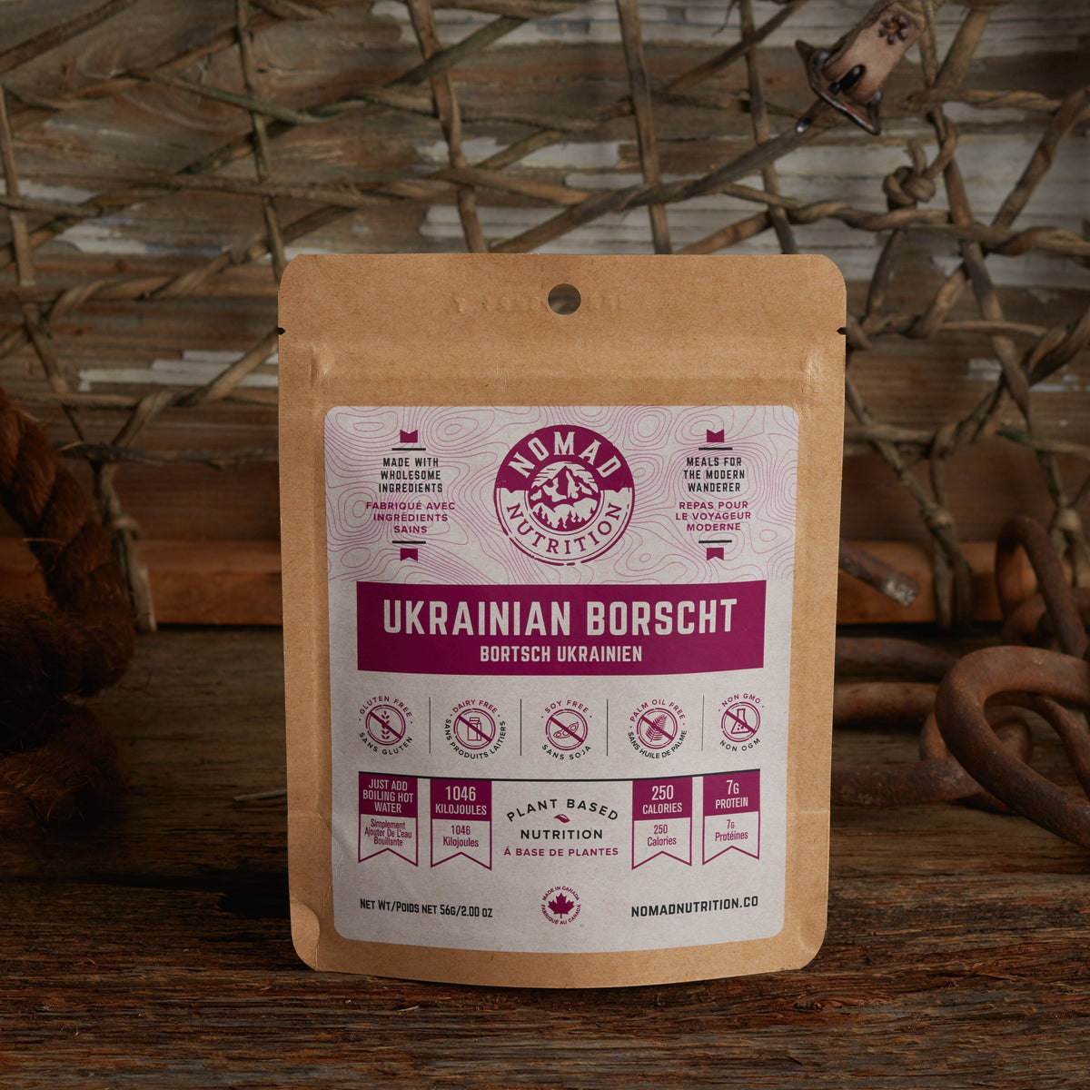 Nomad Nutrition Ukrainian Borscht 56g snack size with outdoor equipments on table top.