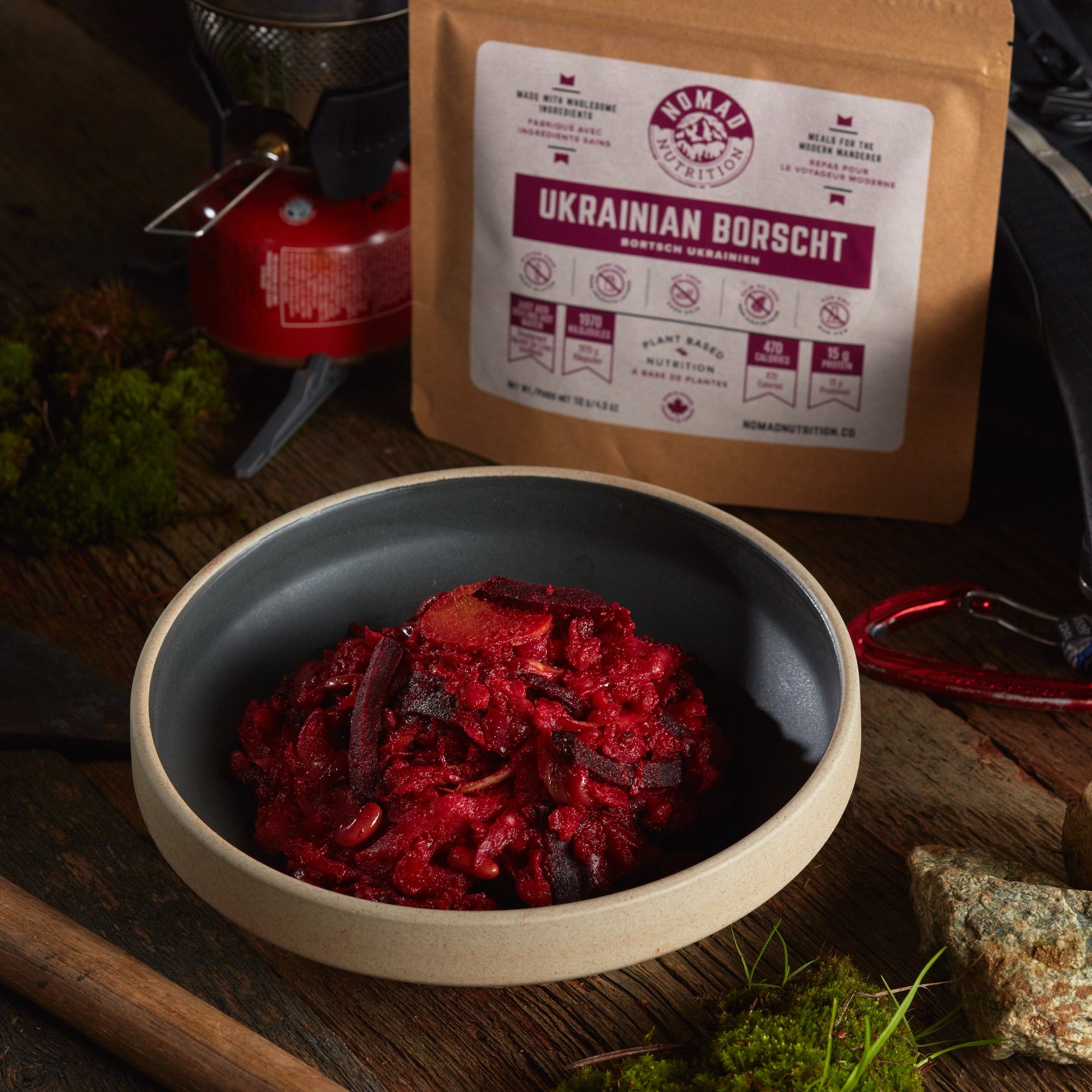 Rehydrated Nomad Nutrition Ukrainian Borscht in a bowl with 112g meal size on table top outdoors. No additional cooking required. 