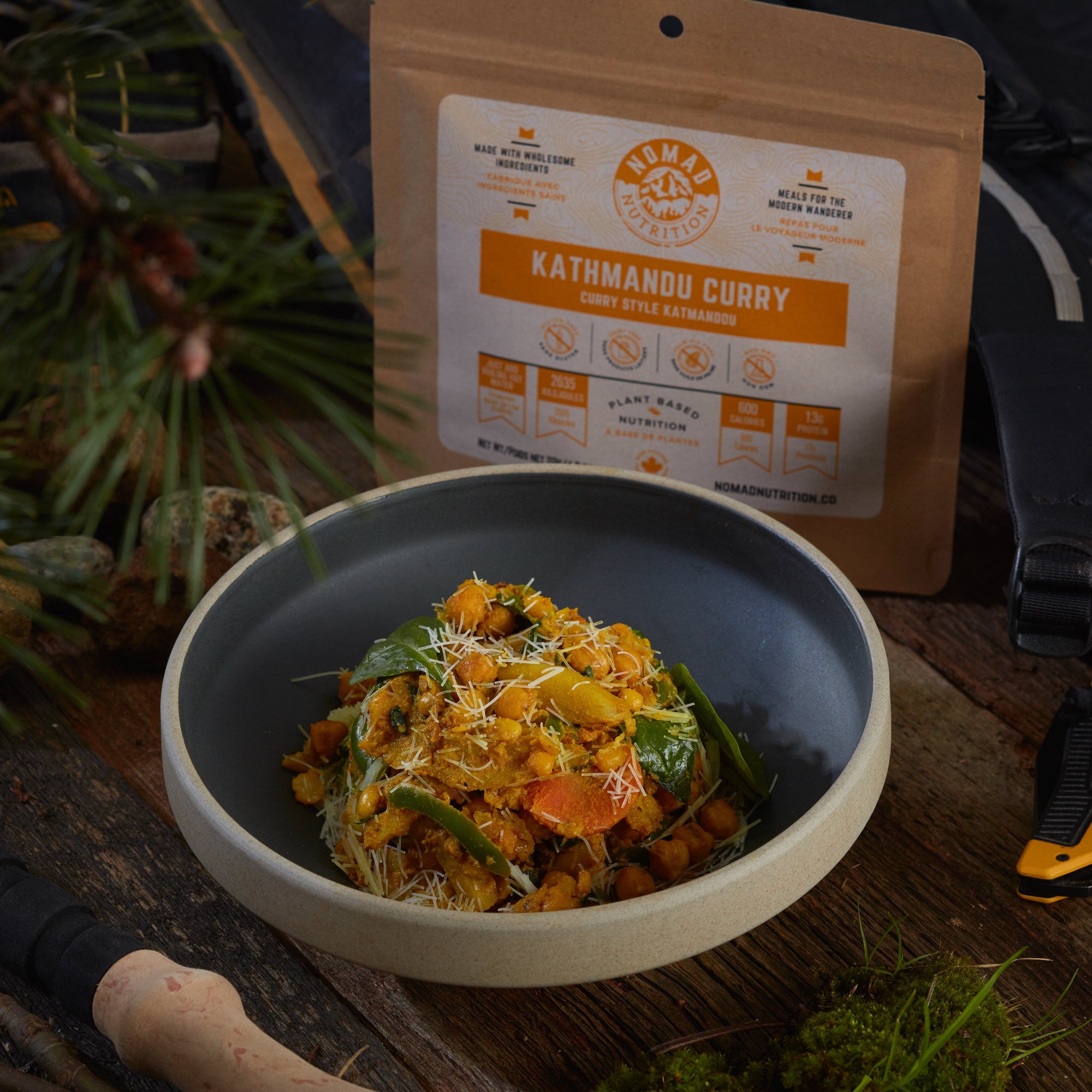 Rehydrated Nomad Nutrition Kathmandu Curry in a bowl with 112g meal size on table top outdoors. No additional cooking required. 